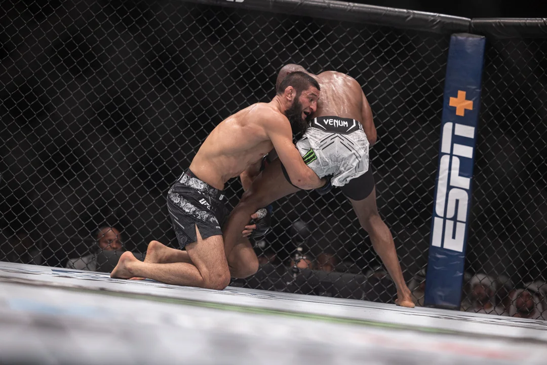 MMA action — wrestling entry versus upright striker (illustrative frame for UFC-style matchup discussion)